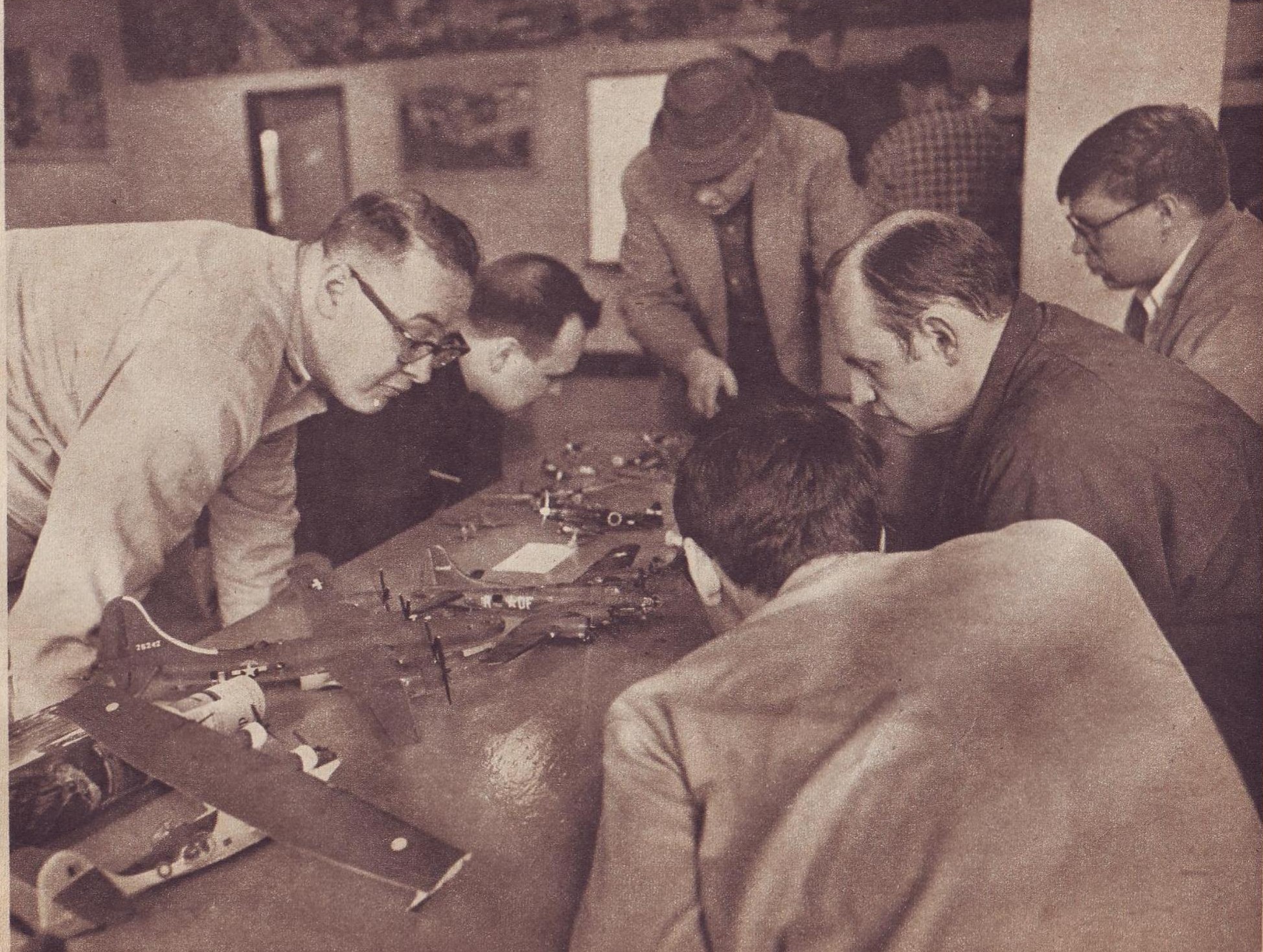 IPMS Seattle members examining aircraft models at a monthly meeting in 1969