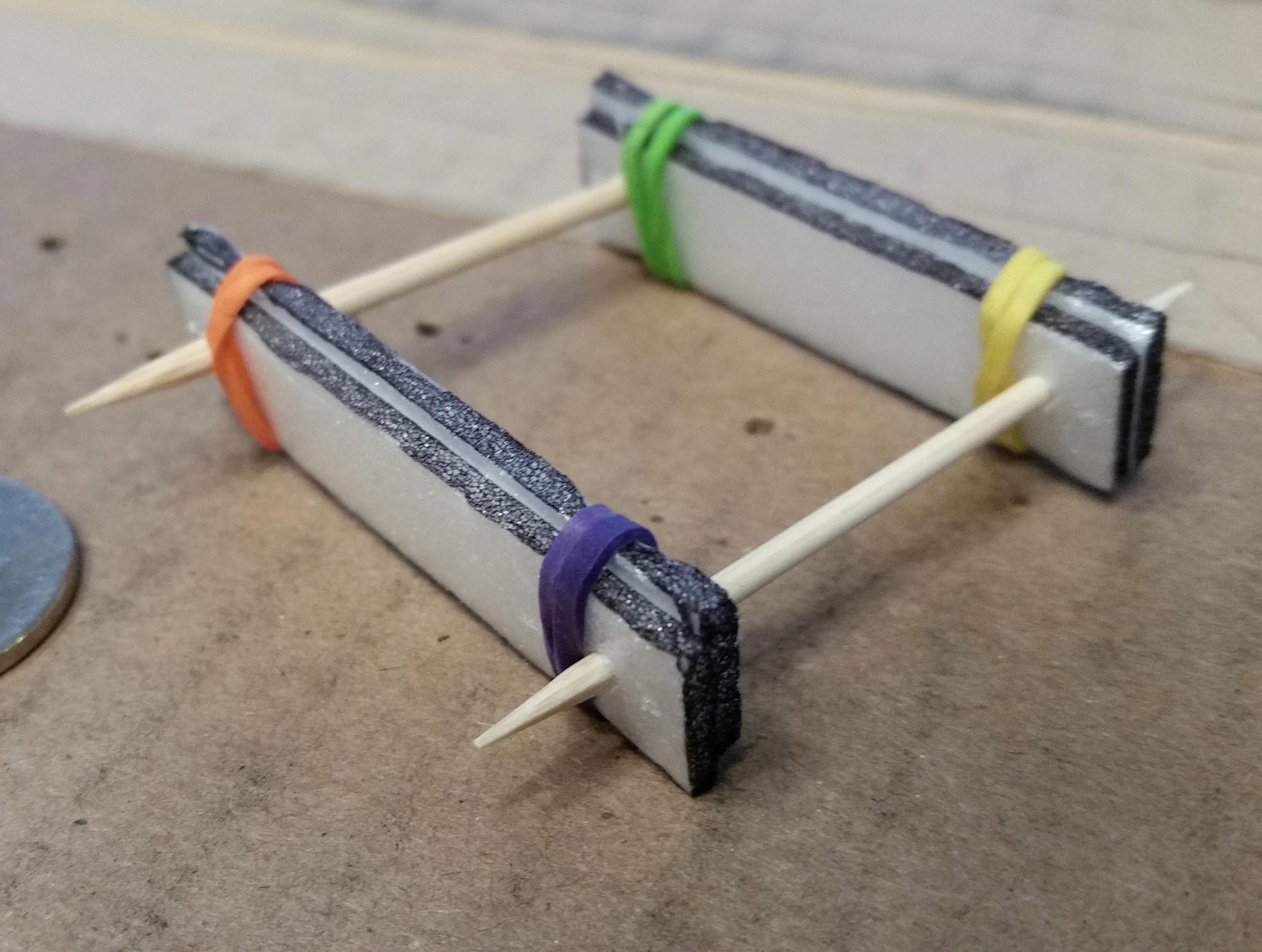 Rubber bands moved inside the toothpicks.